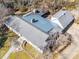 An aerial view of the home, it's gray roof, and the surrounding lush wooded landscape at 549 Briarwood Ln, Lancaster, SC 29720