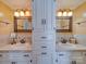 Bathroom featuring double sink vanity with granite counter and ample cabinet storage at 549 Briarwood Ln, Lancaster, SC 29720