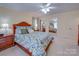 Cozy bedroom with floral bedding, mirrored closet doors, and a bright, airy ambiance at 549 Briarwood Ln, Lancaster, SC 29720