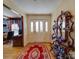 Bright foyer featuring hardwood floors, a decorative mirror, and a view into a study area at 549 Briarwood Ln, Lancaster, SC 29720