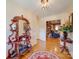 Inviting foyer with hardwood floors, decorative mirror, and a view into the adjacent living room at 549 Briarwood Ln, Lancaster, SC 29720
