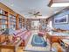 Cozy living room boasting a wall of bookshelves and inviting seating arrangements at 549 Briarwood Ln, Lancaster, SC 29720