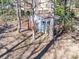 Aerial view of shed surrounded by trees, showing its unique structure with porch and fenced area at 549 Briarwood Ln, Lancaster, SC 29720