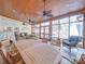 Bright sunroom with wood ceiling, ample seating, and views of the natural surroundings at 549 Briarwood Ln, Lancaster, SC 29720