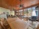 Bright sunroom with wood ceiling, tile floor, and large windows overlooking landscaped backyard at 549 Briarwood Ln, Lancaster, SC 29720