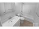 Clean bathroom featuring a vanity, toilet, and a shower-tub combo at 6108 Heath Ridge Ct, Charlotte, NC 28210
