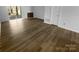 Bright living room featuring new flooring, neutral walls, and access to outdoor space at 6108 Heath Ridge Ct, Charlotte, NC 28210