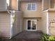 Outdoor patio area with sliding glass door and a view of the backyard at 6108 Heath Ridge Ct, Charlotte, NC 28210