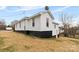 Side view of a single-Gathering home with a walkout basement entrance at 612 Miller St, Kannapolis, NC 28081