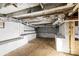 Unfinished basement with exposed ceiling beams and concrete floor awaits customization at 612 Miller St, Kannapolis, NC 28081