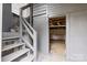 Exterior basement entrance features painted stairs and access to storage at 612 Miller St, Kannapolis, NC 28081