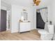 Bright bathroom with a modern vanity, wooden countertop, and a beautifully tiled shower at 612 Miller St, Kannapolis, NC 28081