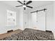 A bedroom featuring a sliding closet door and dark patterned rug at 612 Miller St, Kannapolis, NC 28081
