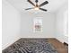 A bedroom featuring a large window and a dark patterned rug at 612 Miller St, Kannapolis, NC 28081