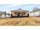 Charming home featuring a covered front porch, classic black shutters, and a well-maintained yard at 612 Miller St, Kannapolis, NC 28081