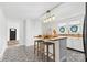 Bright kitchen featuring a center island with barstool seating, lots of natural light, and black appliances at 612 Miller St, Kannapolis, NC 28081