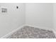 A well lit laundry room features decorative tile flooring and updated plumbing fixtures at 612 Miller St, Kannapolis, NC 28081