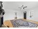 Bright living room boasts beautiful hardwood floors, ceiling fan, and an open entryway at 612 Miller St, Kannapolis, NC 28081