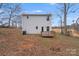 Rear exterior view of a two-story home with a wood deck and vinyl siding at 613 N Pink St, Cherryville, NC 28021