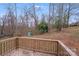 View from a wood deck, overlooking a wooded backyard with playhouse at 613 N Pink St, Cherryville, NC 28021