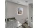 Bathroom featuring a granite countertop, a shower-tub, and wood-look floors at 613 N Pink St, Cherryville, NC 28021