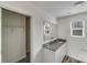 Bathroom with granite countertop, large mirror, and a closet at 613 N Pink St, Cherryville, NC 28021