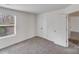 Bedroom featuring carpeting, neutral walls, and closet space at 613 N Pink St, Cherryville, NC 28021