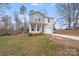 Two story home with a combination of gray and white siding and a single car garage at 613 N Pink St, Cherryville, NC 28021