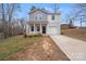 Charming two-story home with a well-manicured lawn and a private driveway at 613 N Pink St, Cherryville, NC 28021