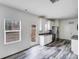 Bright kitchen with stainless steel appliances, granite countertops, and easy access to the backyard at 613 N Pink St, Cherryville, NC 28021