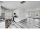 Well-lit kitchen area with stainless steel appliances and granite countertops at 613 N Pink St, Cherryville, NC 28021