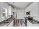 Modern kitchen with stainless steel appliances, granite countertops, and white cabinets at 613 N Pink St, Cherryville, NC 28021