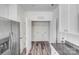 Conveniently located laundry area with ample storage space near the stainless steel refrigerator at 613 N Pink St, Cherryville, NC 28021