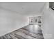 Bright and airy living room featuring gray, wood-look floors and ample natural light at 613 N Pink St, Cherryville, NC 28021