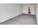 Spacious living room offers neutral walls and plush carpeting at 613 N Pink St, Cherryville, NC 28021
