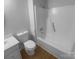This bathroom includes a shower-tub combo, toilet, and white vanity at 6440 Tivoli Ct, Charlotte, NC 28211
