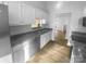 Clean kitchen with new floors, white cabinets, stainless steel appliances and granite countertops at 6440 Tivoli Ct, Charlotte, NC 28211