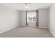 A spacious bedroom with a ceiling fan and a window with patterned curtains at 6565 Derby Nw Ln, Concord, NC 28027