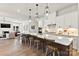 A modern eat-in kitchen featuring a large island with pendant lighting and stainless steel appliances at 6727 Baker Creek Ave, Indian Land, SC 29707