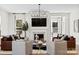 Inviting living room with a fireplace, modern chandelier, and neutral decor at 6727 Baker Creek Ave, Indian Land, SC 29707