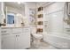 Bright bathroom featuring white cabinets, modern fixtures, and a shower-tub combination at 7236 Hodges Meadow Ln, Charlotte, NC 28213