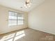 Bedroom features neutral carpet and large window with natural lighting at 831 Lacebark Dr, Rock Hill, SC 29732