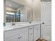Bathroom featuring double vanity with white cabinets, countertops, and a large mirror at 8422 Norman Forest Rd, Lancaster, SC 29720