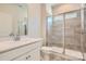 Modern bathroom featuring a single vanity, white countertops, walk-in shower with glass door, and tiled floors at 8422 Norman Forest Rd, Lancaster, SC 29720