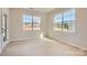 Well-lit bedroom featuring hardwood floors, neutral paint, and large windows providing natural light at 8422 Norman Forest Rd, Lancaster, SC 29720
