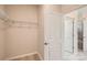 Spacious walk-in closet providing ample storage with wire shelving and easy access to the adjoining bathroom at 8422 Norman Forest Rd, Lancaster, SC 29720