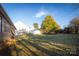Large grassy backyard with a fence and shade trees at 924 41St Avenue Ne Dr, Hickory, NC 28601