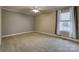 Cozy bedroom with neutral walls, carpeted floor, ceiling fan and a bright window view at 924 41St Avenue Ne Dr, Hickory, NC 28601