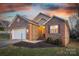 Charming brick home featuring a two-car garage and professionally landscaped front yard at 924 41St Avenue Ne Dr, Hickory, NC 28601
