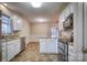 Efficient kitchen layout with stainless steel appliances, bright lighting, and adjacent dining area at 924 41St Avenue Ne Dr, Hickory, NC 28601
